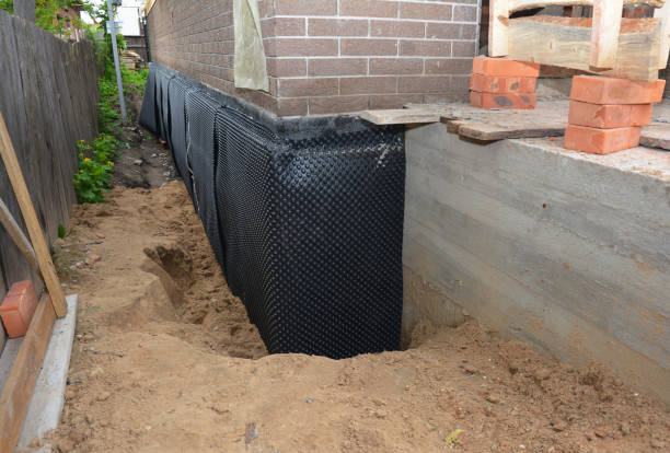 Happy homeowners after waterproofing job in Latonia